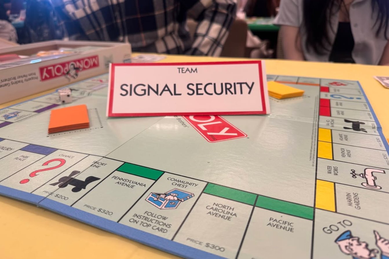 Team Signal Security table at The Eastmont Foundation's Monopoly for the Monarch fundraiser in Lincoln